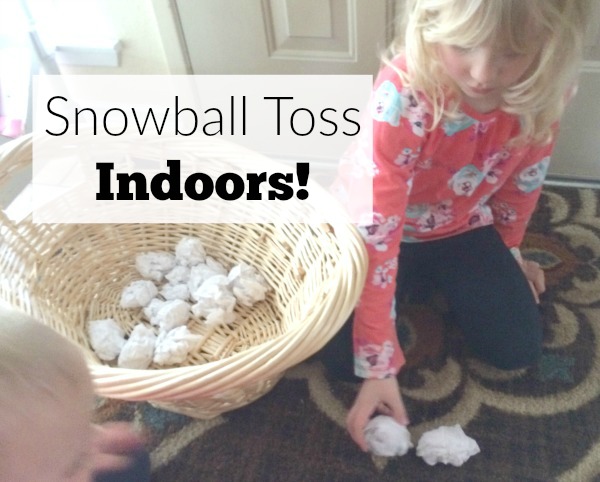 Too cold to play in the snow outside or don't have any snow where you live? Bring the snowball toss indoors for some gross motor fun for babies, toddlers, preschoolers and school age kids. This is so easy to set up with only two supplies. Great for indoor winter fun!