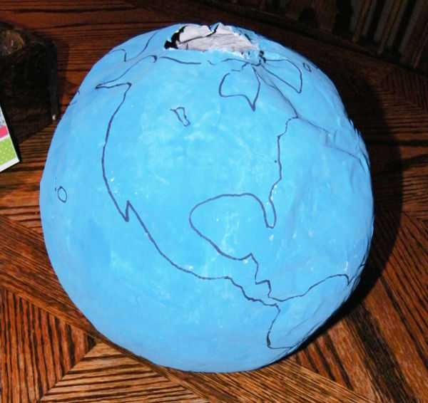 Freehand drawn on continents that get painted by the child.