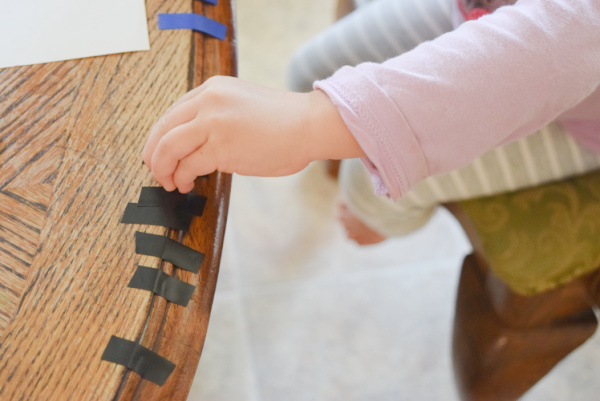Electrical tape in different colors can be cut into small strips for preschoolers to use as a patterning tool.