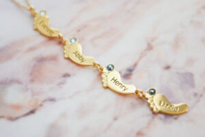 Personalized baby feet necklaces and jewelry make meaningful gifts for mothers.