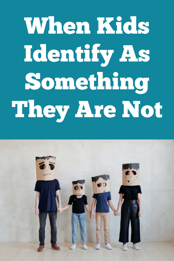 Keluarga beranggotakan empat orang dengan topeng frankenstein di teks berbunyi ketika anak-anak mengidentifikasi diri mereka sebagai sesuatu yang bukan diri mereka.  Nasihat dan kebenaran parenting untuk membantu anak-anak kita melalui krisis identitas.