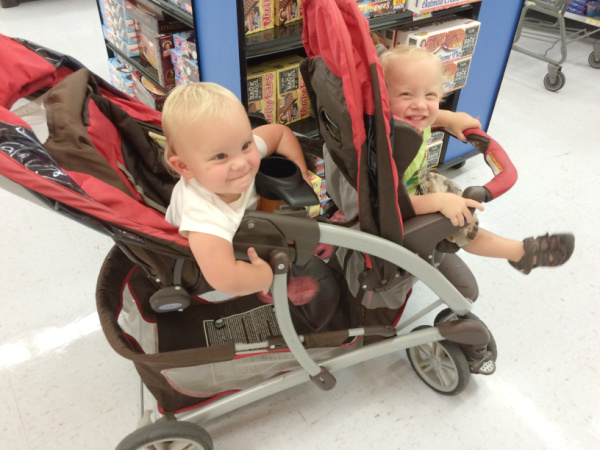 Twin babies in stroller.