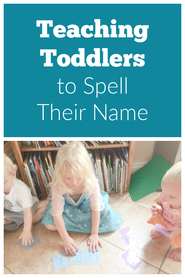 Three small children sitting on the floor in front of a bookshelf playing the name game for teaching toddlers to spell their name.