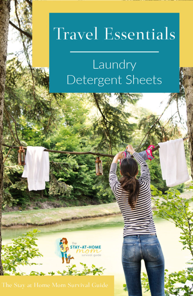 Woman hanging laundry up to dry on a clothesline between two trees. Text reads Travel Essentials laundry detergent sheets.