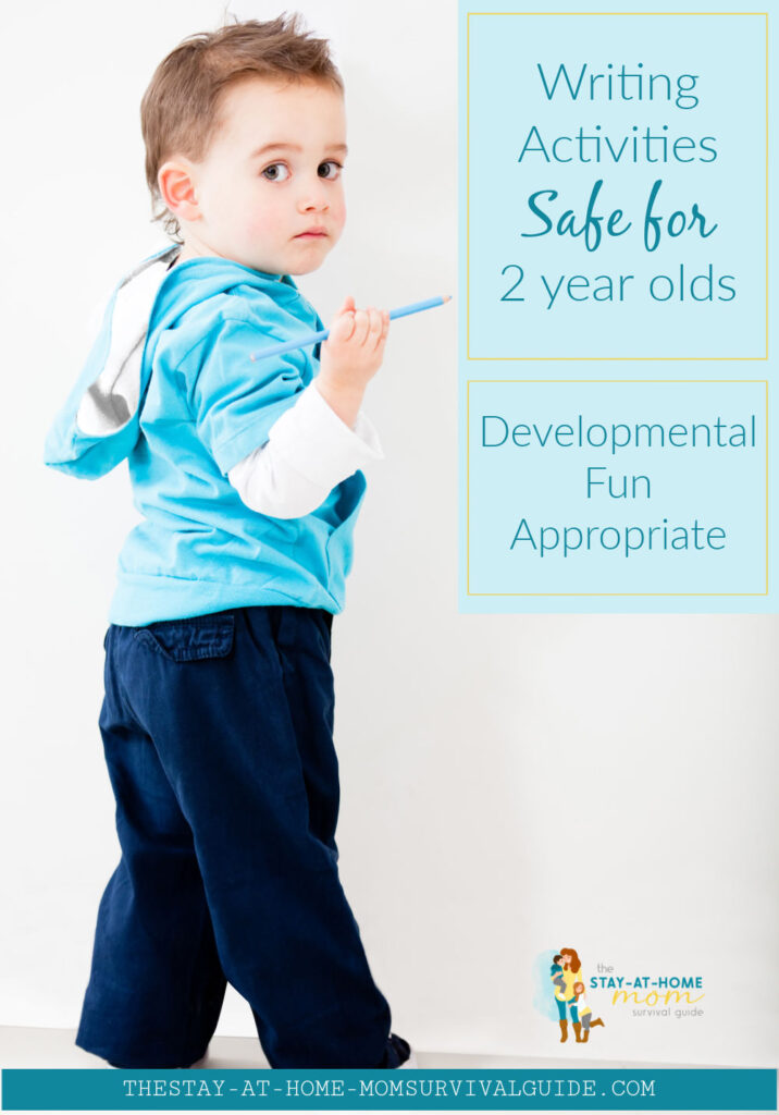 Toddler boy with a colored pencil standing by a white wall. Text reads writing activities safe for 2-year-olds developmental, fun, appropriate.