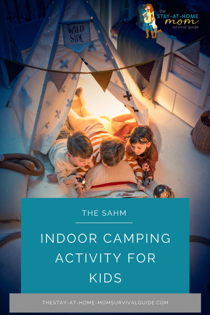 Three kids lying on the floor reading a book while snuggled in a tent with light coming from inside. Text reads indoor camping activity for kids.