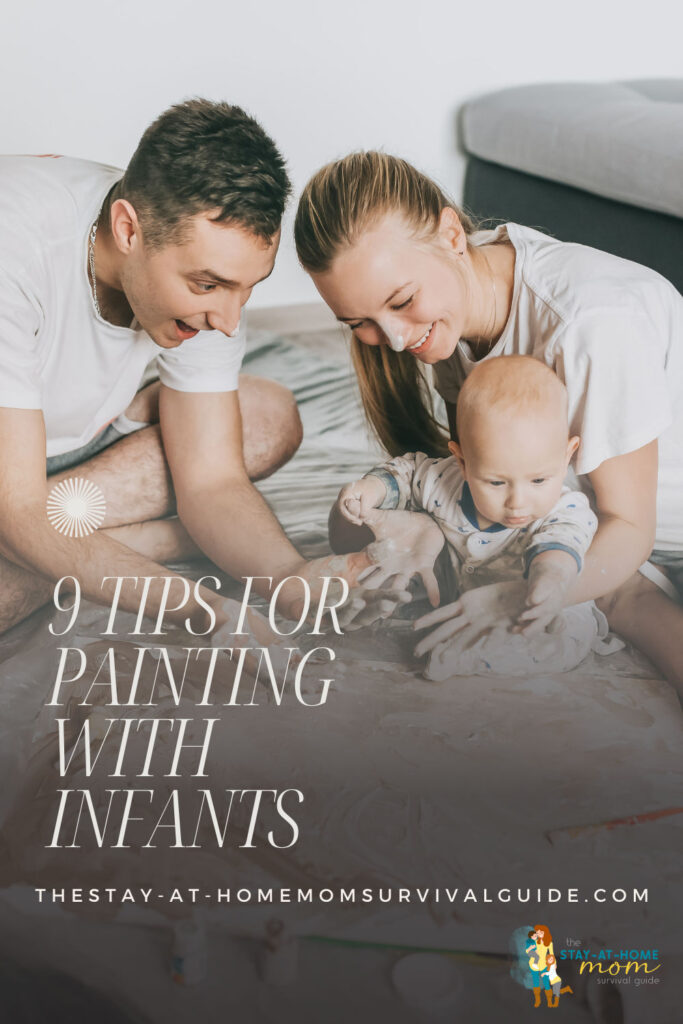 A mom and dad sitting with their baby on the floor. Baby is finger painting. Mom and dad are smiling. Text reads 9 tips for painting with infants.