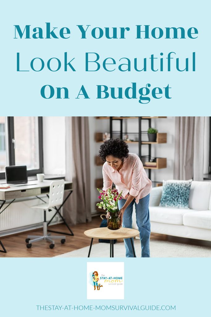 Woman placing a vase of flowers on a small occasional table. Text reads make your home look beautiful on a budget.